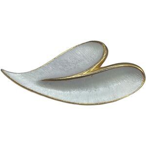 Vintage J.J. Brooch Modernist white enamel on gold colored metal.